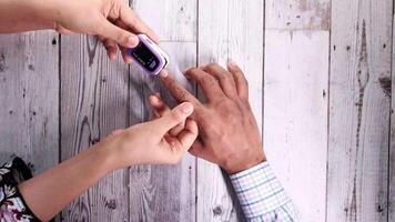 A person is using a blood glucose meter video