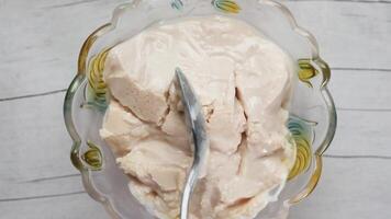 A bowl of ice cream with a spoon in it video
