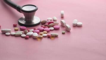 A stethoscope is sitting on top of a pile of pills video