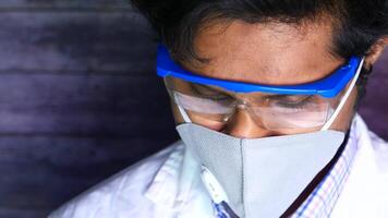 A man wearing a face mask and glasses video