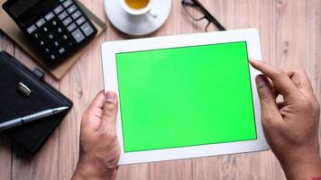 Green screen tablet with business concept video