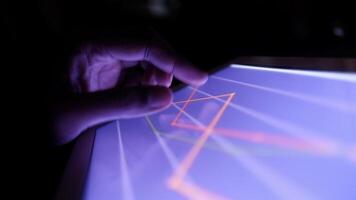 A person is using a tablet computer with a graph on it video