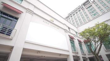 The white building has a large sign on it video