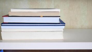 stack of books on wooden table video
