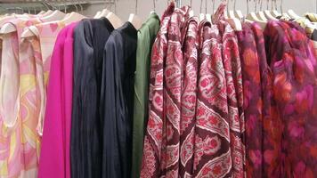 A rack of colorful dresses hanging on a rack video