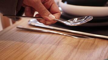 An Elegant Set of Dining Cutlery Beautifully Arranged on a Dark Tablecloth Setting video