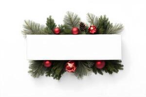 Top view layout with horizontal center blank space box adorned pine tree branch, red ball and pine cone on white background photo
