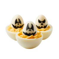 Three deviled eggs with pumpkin faces for Halloween png