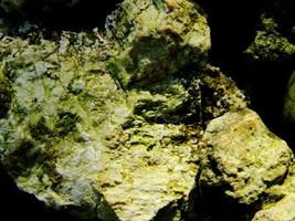 Abstract background with mountain rocks. Large shaped rocks that can be found on the shore of the sea, lake or river. photo