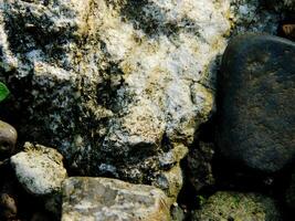 Abstract background with mountain rocks. Large shaped rocks that can be found on the shore of the sea, lake or river. photo