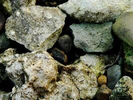 Abstract background with mountain rocks. Large shaped rocks that can be found on the shore of the sea, lake or river. photo