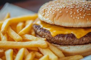 A hamburger with cheese and a bun is shown photo