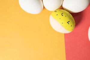Easter eggs on a red and yellow background with copy space for text. photo