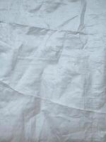 white sack texture and pattern. Arranged on a simple white background. For banners, website covers photo