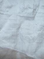 white sack texture and pattern. Arranged on a simple white background. For banners, website covers photo