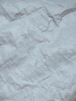 white sack texture and pattern. Arranged on a simple white background. For banners, website covers photo