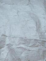 white sack texture and pattern. Arranged on a simple white background. For banners, website covers photo