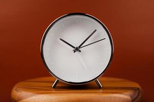 Alarm clock still photo in studio. Concept of time and working with valuable time.