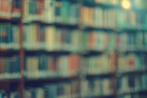 Blurred library background with books, abstract academic and calm atmosphere. photo