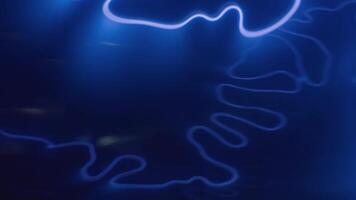 Abstract flowing neon light waves in blue against dark background. Background with futuristic and dynamic visual effect video