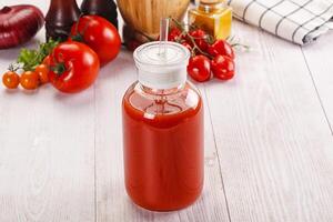 Fresh Tomato juice in the glass photo