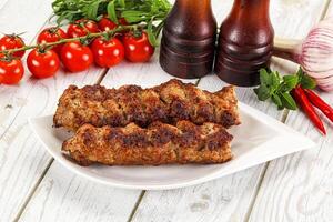 Chicken kebab minced meat and spices photo