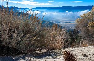 Beautiful mountain scenery on the background of clouds, layers of mountains on the horizon, Sierra Nevada Mountains, California, USA photo