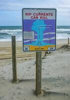 New Jersey, USA - November 19, 2009 warning information sign Rip Currents Can Kill on the oceanfront in New Jersey, USA photo