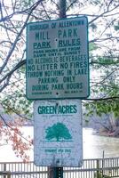 New Jersey, USA - November 19, 2009 warning information sign in a city park in suburban New Jersey, USA photo