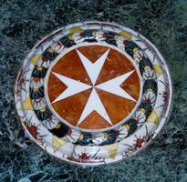 Maltese cross in marble, Chapel of St. John's Cathedral near Valletta in Malta photo