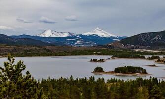 Snow-capped mountains in the background of a mountain lake in Utah, nature US photo