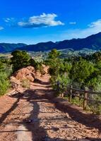 A wooden fence with a shadow from the sun, Garden of the Gods, US photo