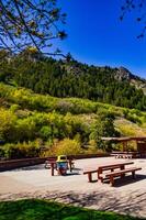 Table and benches in a recreation area near a small river in Utah, US photo