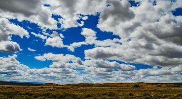 Rain clouds during the day over the plains in Utah, US photo