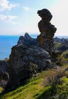 Mountain landscape, vertical weathered volcanic rocks on the slopes of the mountains photo