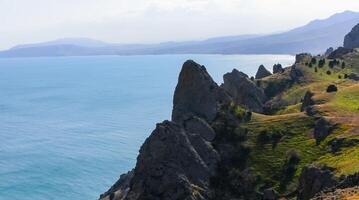 Kara-Dag, colorful volcanic rocks along the Black Sea coast in the national park, Crimea photo