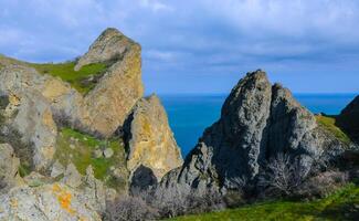 Kara-Dag, colorful volcanic rocks along the Black Sea coast in the national park, Crimea photo
