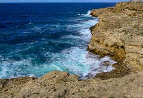 High steep stone coast during a storm in the Crimea, Tarkhankut photo