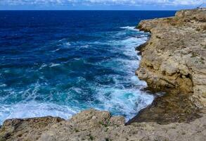 High steep stone coast during a storm in the Crimea, Tarkhankut photo