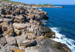 Coastal cliffs from the north side of Serpent's Zmeinyi Island, Ukraine photo