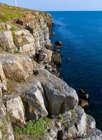 Coastal cliffs from the north side of Serpent's Zmeinyi Island, Ukraine photo