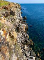 Coastal cliffs from the north side of Serpent's Zmeinyi Island, Ukraine photo