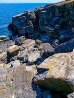 Coastal cliffs from the north side of Serpent's Zmiinyi Island, Ukraine photo