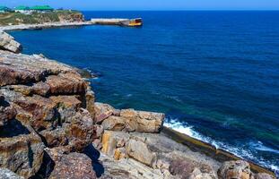Coastal cliffs from the north side of Serpent's Zmiinyi Island, Ukraine photo