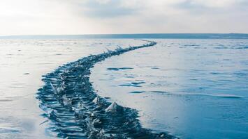 Frozen estuary in winter, frozen cracks on the ice of the Tiligulsky estuary, Odessa region photo