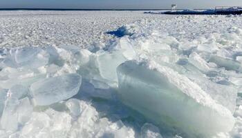 The frozen Black Sea, chunks and blocks of sea ice swaying on the water photo