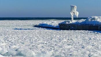 Frozen Black Sea, blocks of ice on the shore on the pier photo