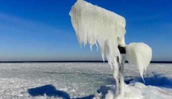 Frozen Black Sea, blocks of ice on the shore on the pier photo