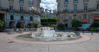 NANTES, FRANCE - SEPTEMBER 12, 2017 - Nantes - Place Graslin, fountain in the center of the square, France photo