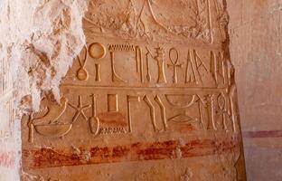 EGYPT, LUXOR - MARCH 01, 2019 archaeological site, drawings and geoglyphs on the walls of an ancient temple, the temple of Hatshepsut near Luxor in Egypt photo